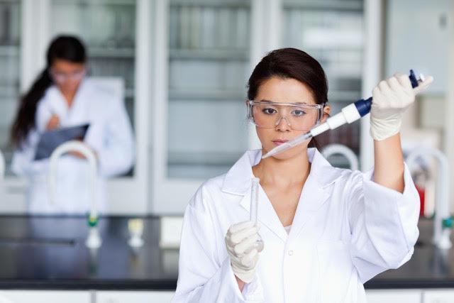 Female Scientist with Pipette and Test Tube